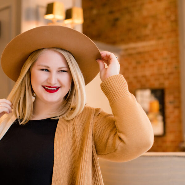 Blonde girl in hat.