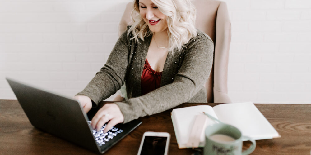 woman at computer for how to offer secure online payments.