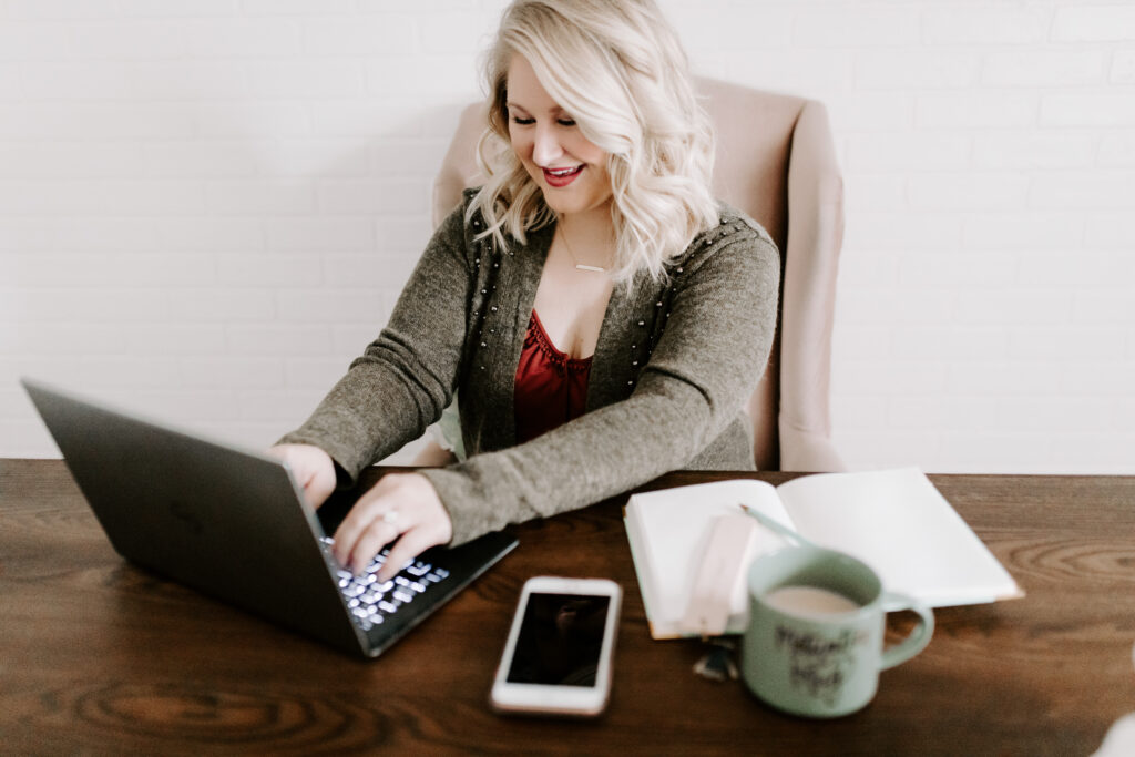 woman at computer for how to offer secure online payments. 